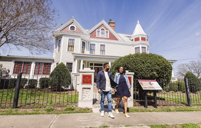 Couple outside the Newsome House