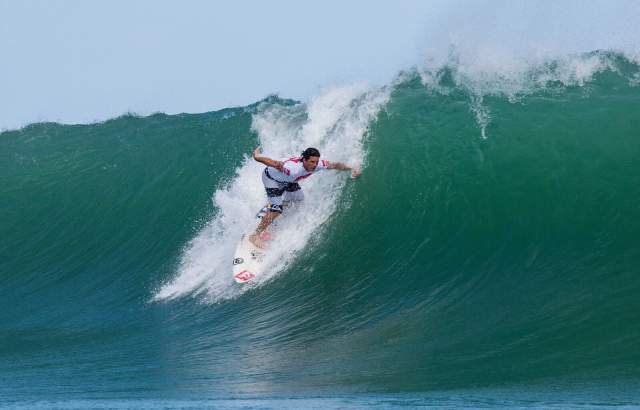 Man surfing a wave at Isla Colon
