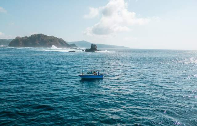 Beautiful blue sea with boat sailing in the Gulf of Montijo in Veraguas
