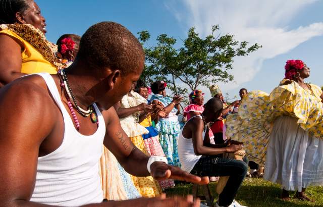 Men playing drums and women performing congo dances  spanish colonial fortress.  Colon province, Panama, Central America.