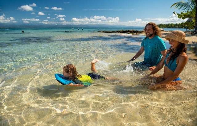 Family enjoy at pristine Estrella Beach, Isla Colón, Bocas del Toro