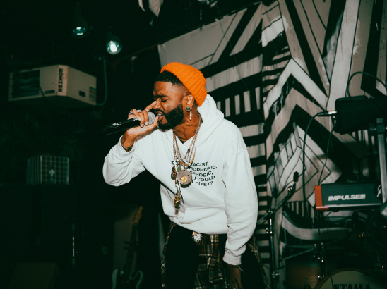 performer singing with mic in hand