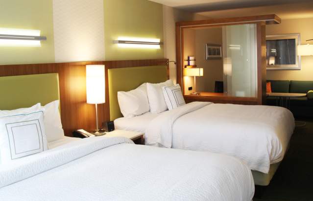 Two-queen hotel room in Bloomington