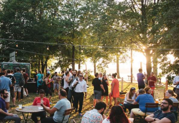 A Crowd At Owl's Nest Beer Garden In Boston, MA