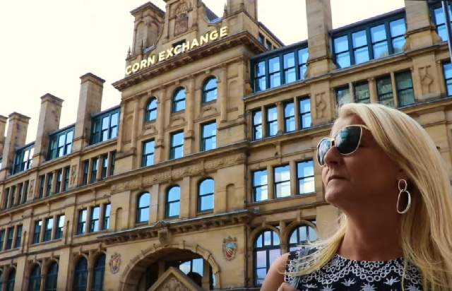 Sandy Lindsay MBE outside the corn exchange Manchester