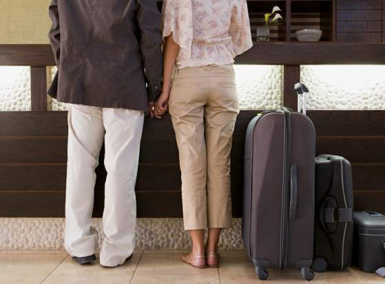 A close up of a couple checking in to an extended stay hotel in Norman, Oklahoma