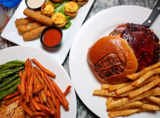 Overhead image of burgers, fries, and other eats from The Lokal in Norman, Oklahoma