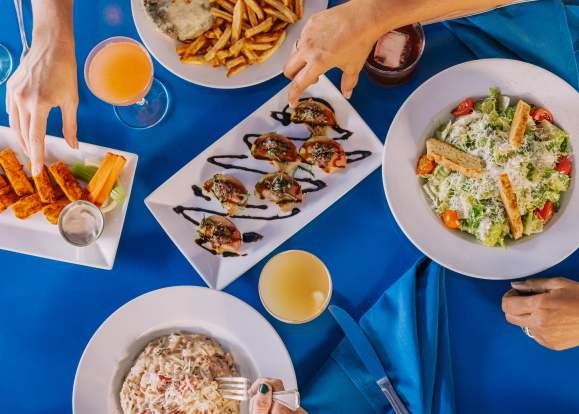 blue table cloth with shared plates