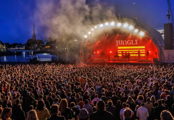 Jungle performing on the stage at Bristol Sounds with audience in foreground - credit Bristol Sounds