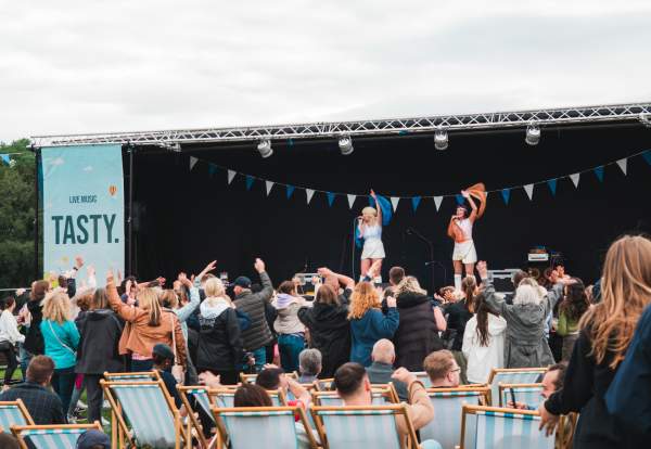 Performers on stage at Heaton Park Food & Drink Festival