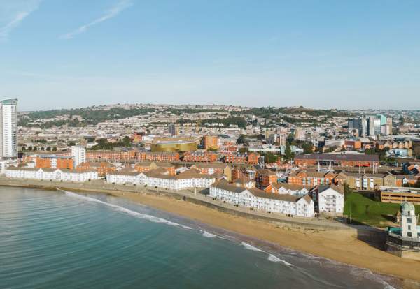 Arial view of Swansea city from the sea