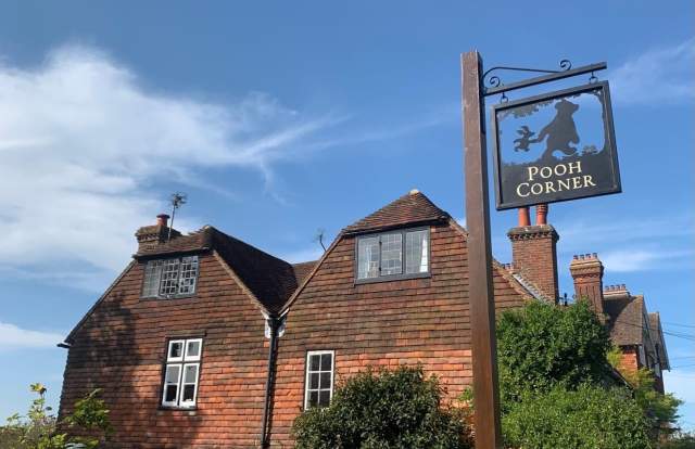 Pooh Corner sign, showing Winnie the Pooh and piglet