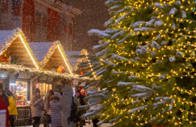 A christmas market and sparkling christmas tree