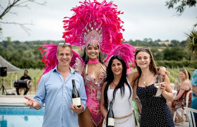 A Summer party at Oastbrook vineyard with Samba dancers and owners of the vineyard
