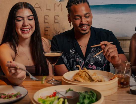 Friends dining at Palm Tree Club