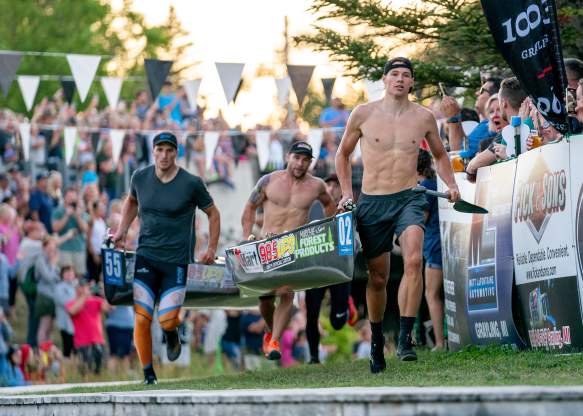 AuSable Canoe Marathon Paddlers running