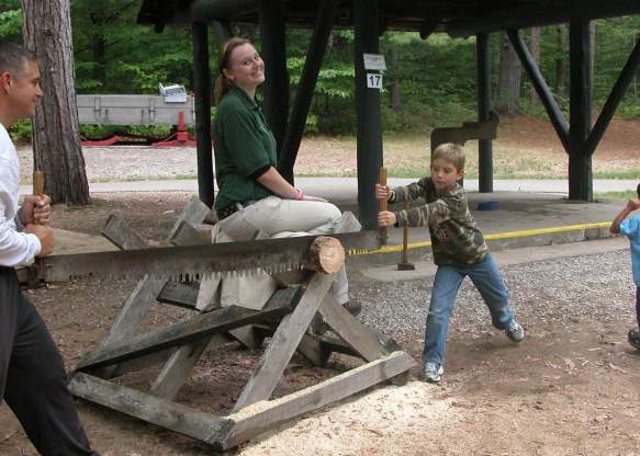 Kids sawing during Forest Fest