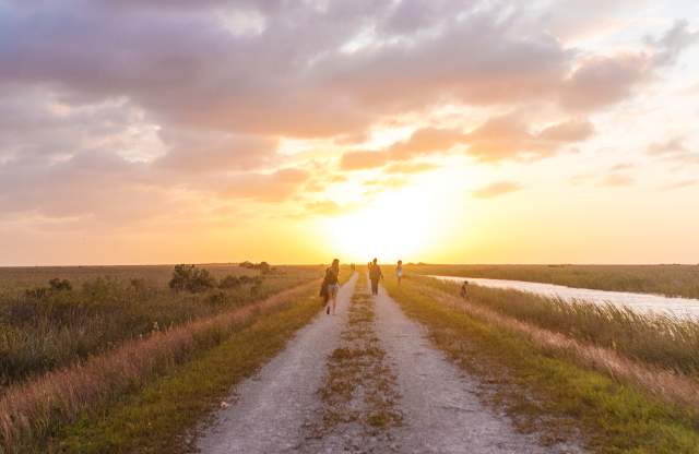 People walking along Atlantic Trailhead path near Coral Springs