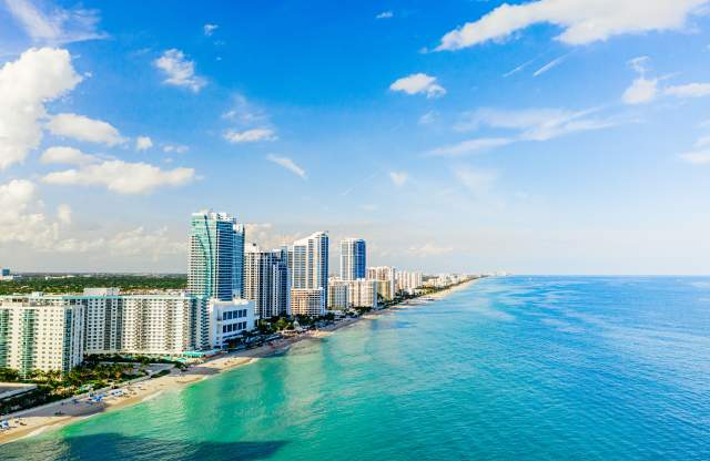 Aerial view of Hallandale Beach and buildings at the shoreline