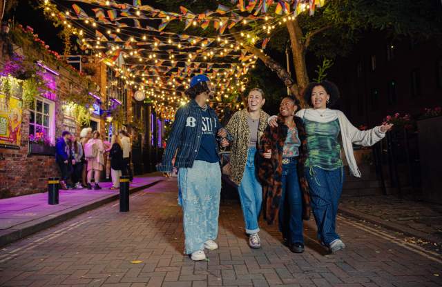 Group of friends exploring gay village in Manchester