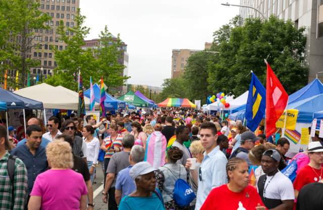 People Walking Among Vendors at RI Pride Parade
