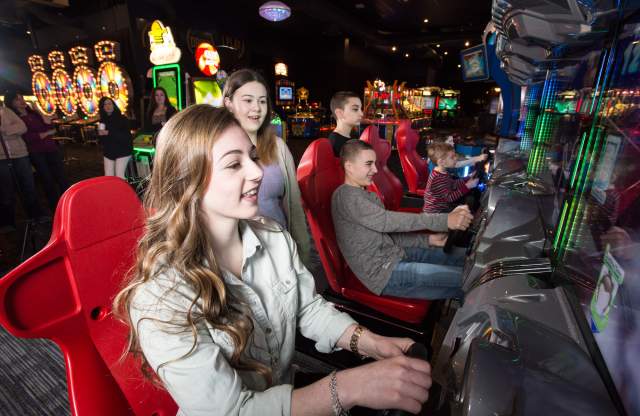 Kids Playing Arcade Game at Dave & Buster’s in Providence, RI