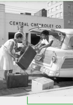 Green Book women loading car