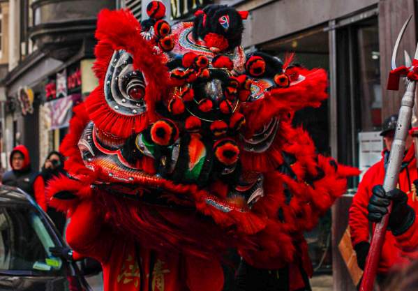 Large Red Dragon Puppet in Street During Chinese New Year Celebration in Boston