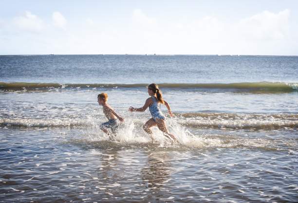Children playing in the ocean