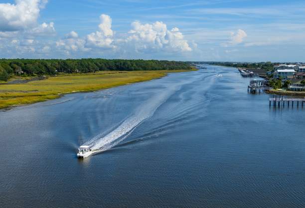 a boat traveling along the Intracoastal Waterway in Ocean Isle Beach