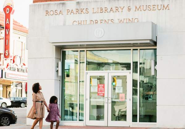 Mom and daughter in front of Rosa Parks Museum