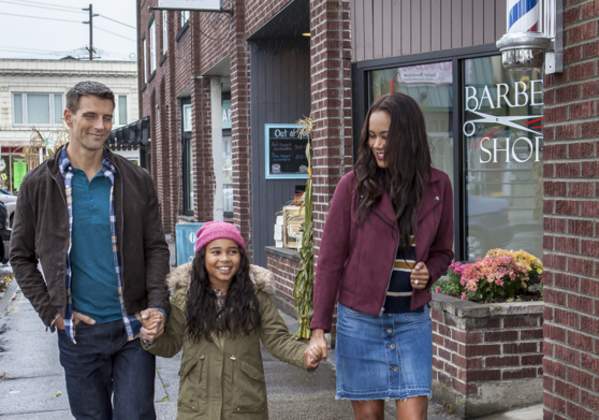 Mother, Father and Daughter Windows shopping in Sumner, Washington