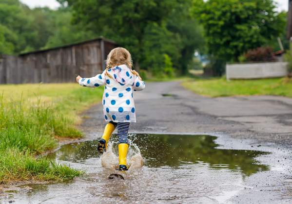 Girl splashing in the rain