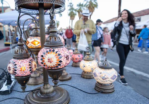 Group walking down Palm Canyon at VillageFest