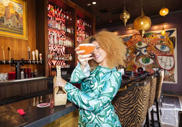 Woman with drink toasting