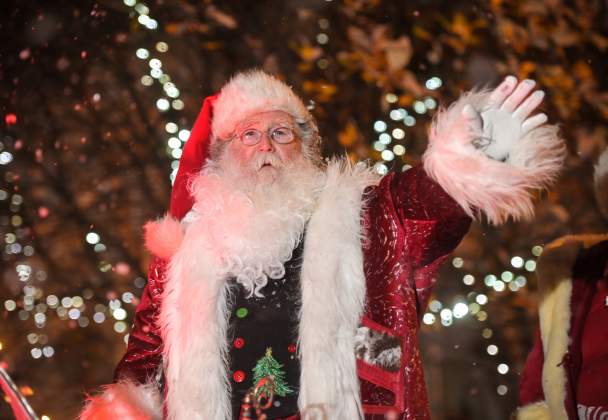 Father Christmas waving from his sleigh in the Swansea Christmas Parade