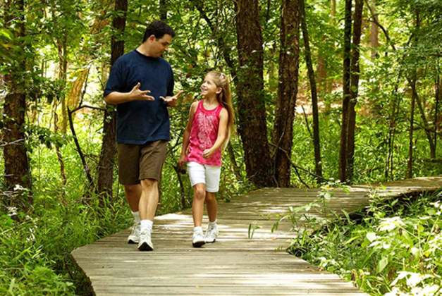 Father and Daughter on Trail Hike in Southeast Texas