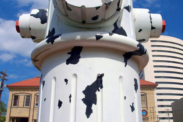 Girl sitting in front of the Giant Fire Hydrant in Beaumont