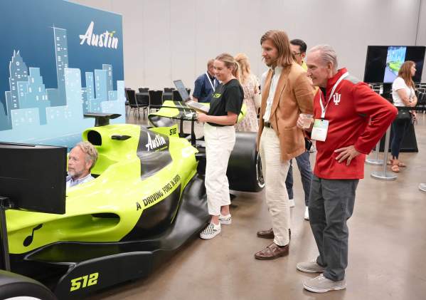 Image of the Austin Sports Commissions F1 Simulator in use at the ASCM Conference.