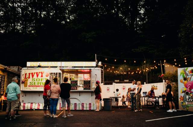 People line up in the evening in front of Livvy's Ice Cream Stand.