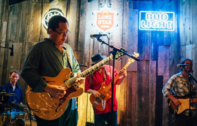 Band on stage at Rustic Tap bar on west sixth street in austin texas