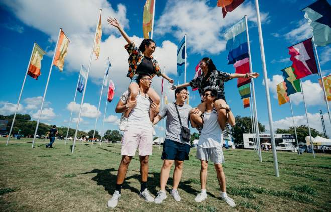 group of people in front of flags at ACL Austin City Limits Music Festival in austin texas
