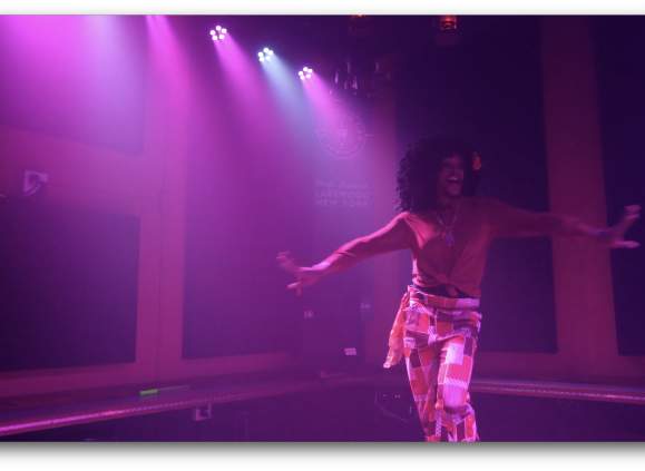 person dancing with purple light