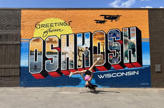 Chloe at Greetings Tour Mural
