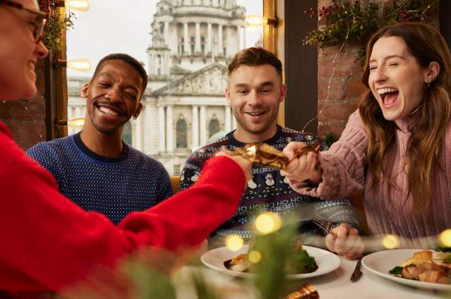 Group enjoying a Christmas dinner at Parisien