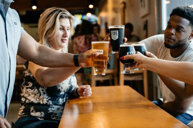 a group of people drinking beer at Metazoa