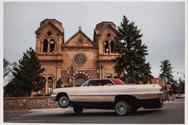 image of lowrider in front of church.