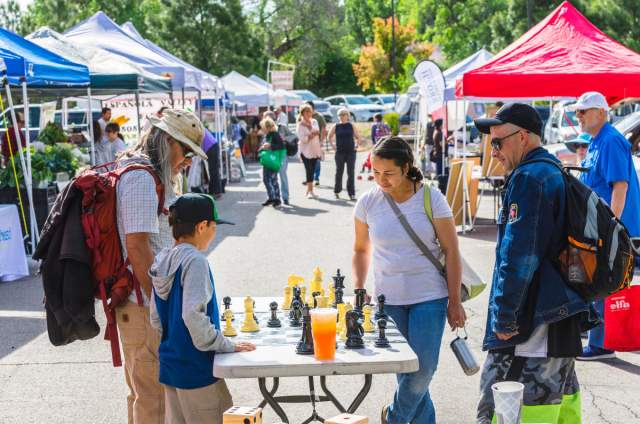 Image of Los Alamos Farmers market in action with people shopping