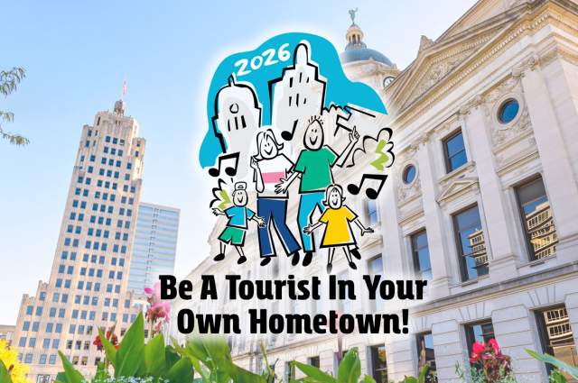 2026 Be A Tourist Logo superimposed over photo of Allen County Courthouse and Lincoln Tower.