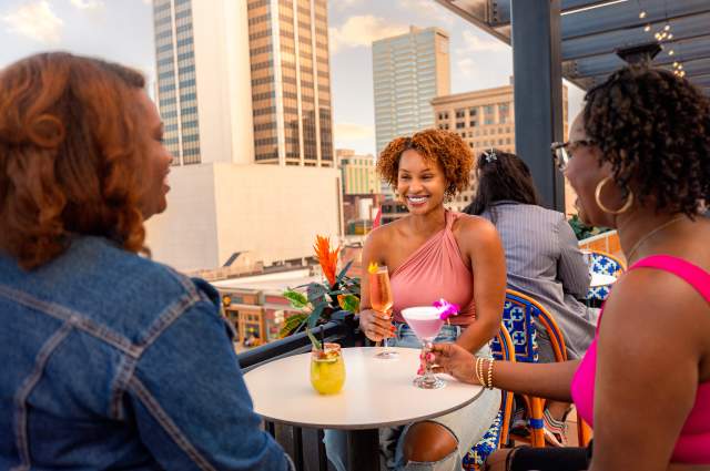 Birdie's Rooftop Bar with a group of women friends at a table overlooking downtown Fort Wayne.